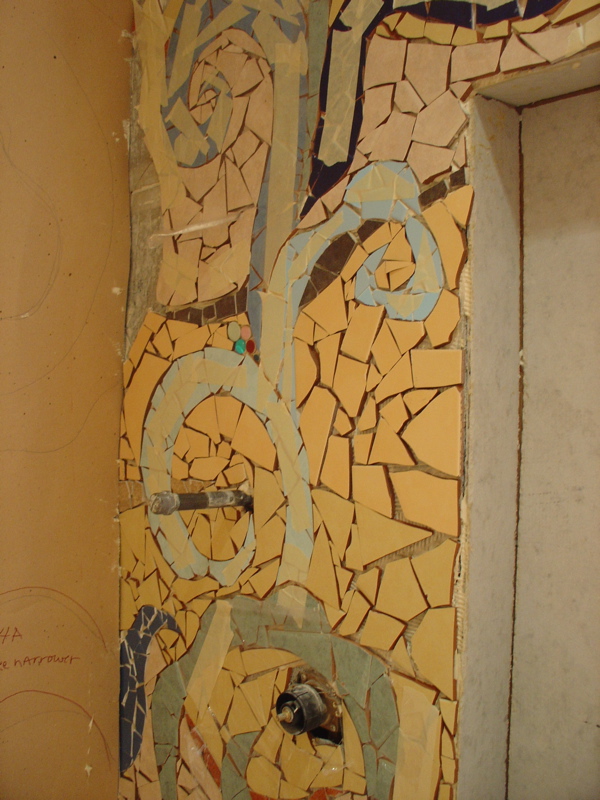 section of installed mosaic with tape still on it.