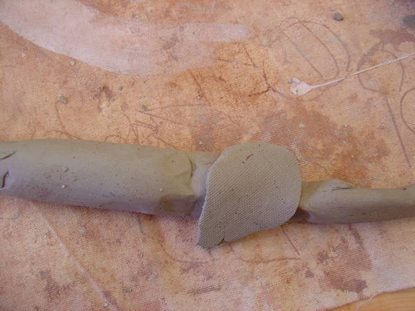 The "clay bandaid" is a wonderful fix-it for many problems where the clay has gotten too thin. This is frequent as students squeeze the clay in an attempt to fix it but it only gets thinner. Add the thin flat piece and have the student blend it in. They love the name.