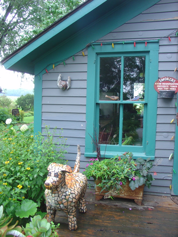 sculpture of her golden retriever by her back door