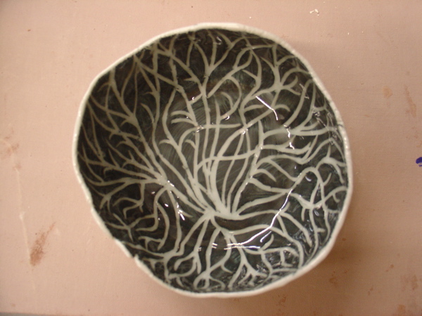 negative sgraffito (black over white, cler glaze)