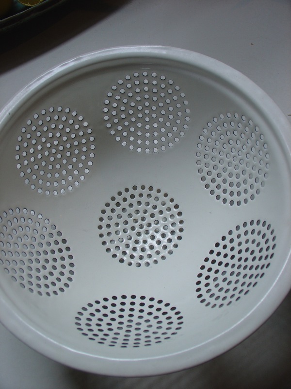 circle pattern in a metal colander